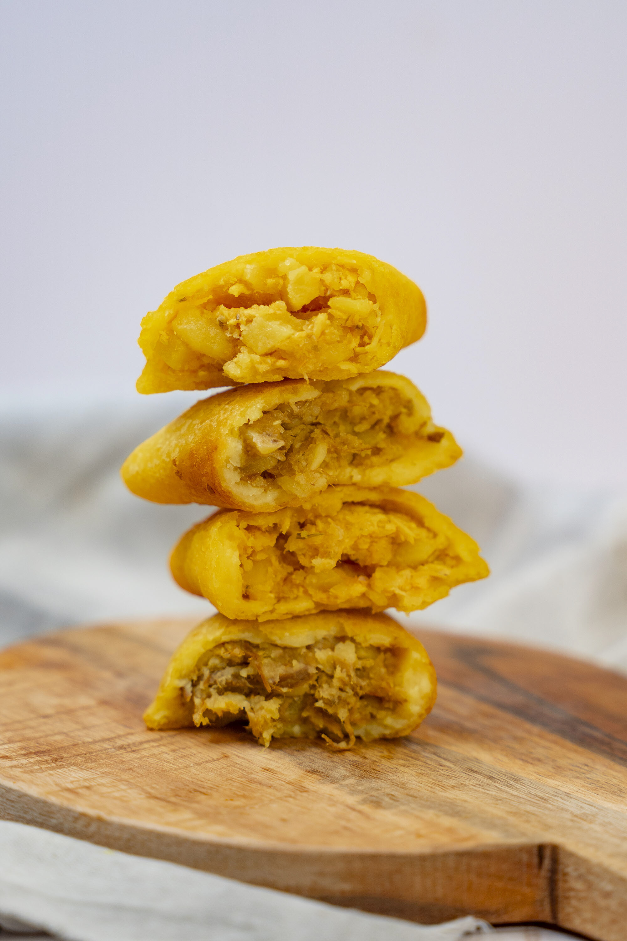 Empanadas cut open showing flavorful fillings